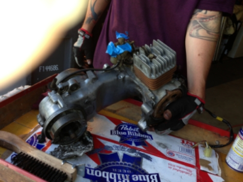 Put a bolt where the spark plug goes while i'm cleaning so i don't damage the plug. taped over some other orifices that i figured should not get dirt in them. I painted the alternator and head vintage rust to give it the classic weathered look.