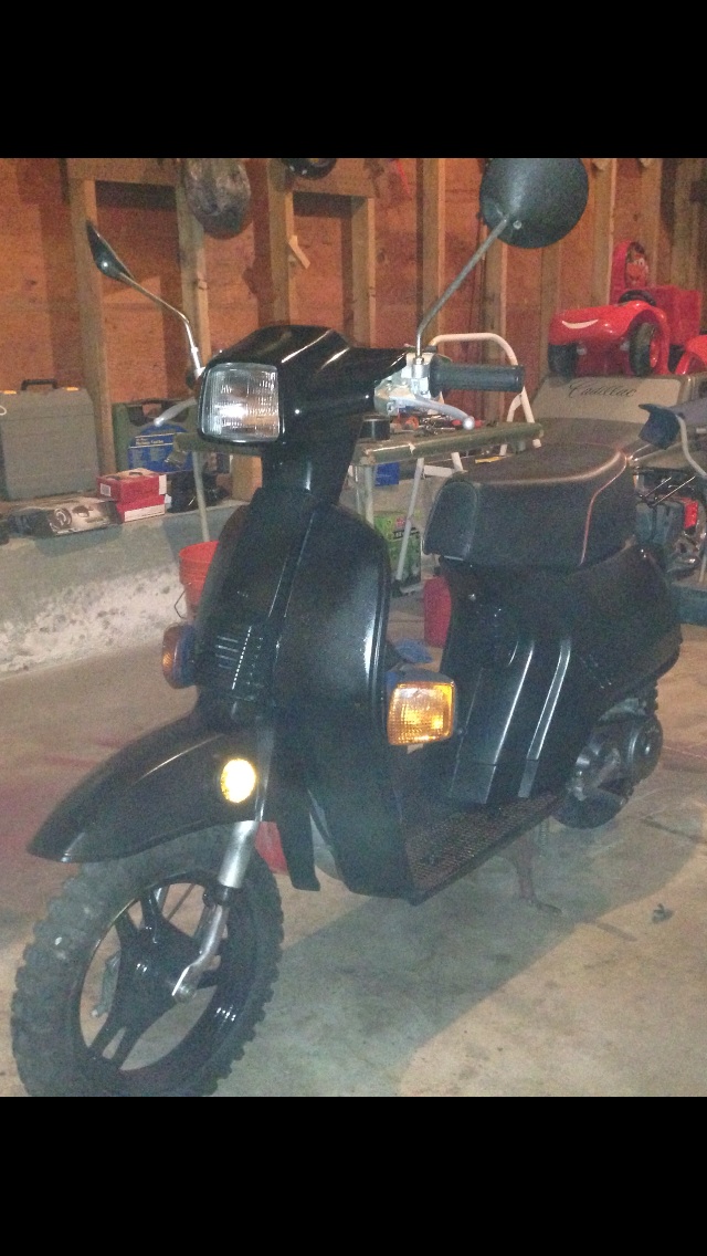 Black rims , knobby tires.